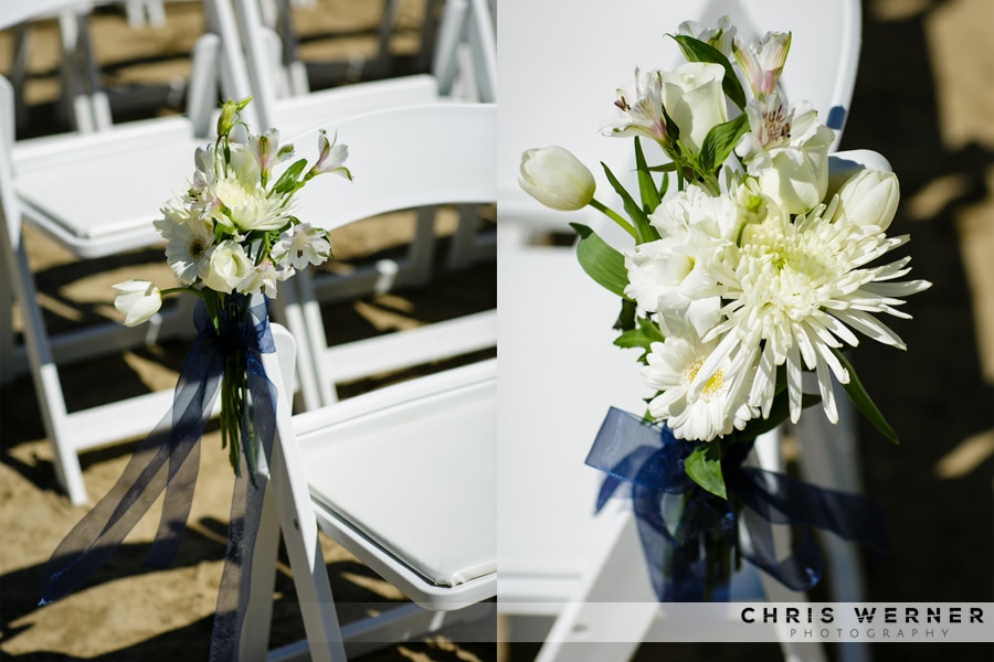 White summery aisle flowers for an outdoor wedding.