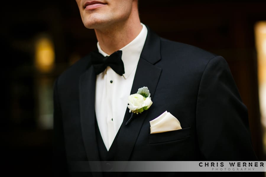 Black tie and white boutonniere idea for a groom or groomsman