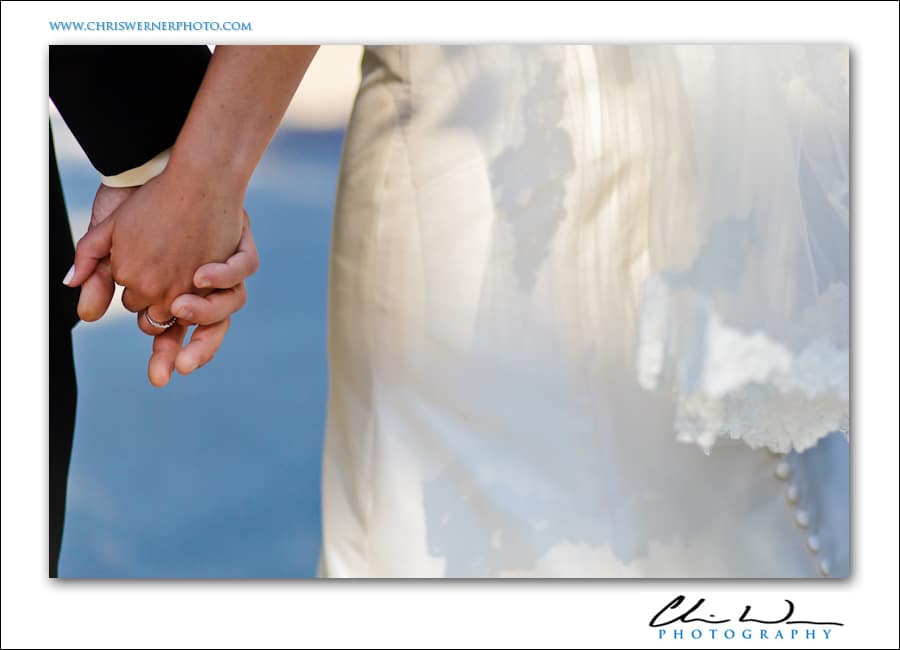 Wedding rings: bride and groom holding hands.