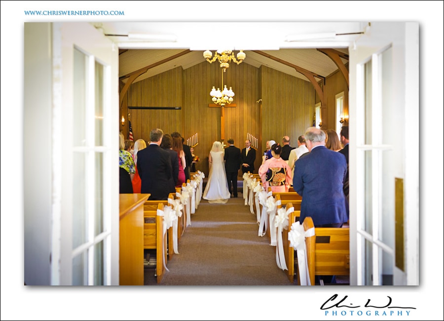 Wedding ceremony inside the Yosemite Valley Chapel, photo by Yosemite Wedding Photographers.