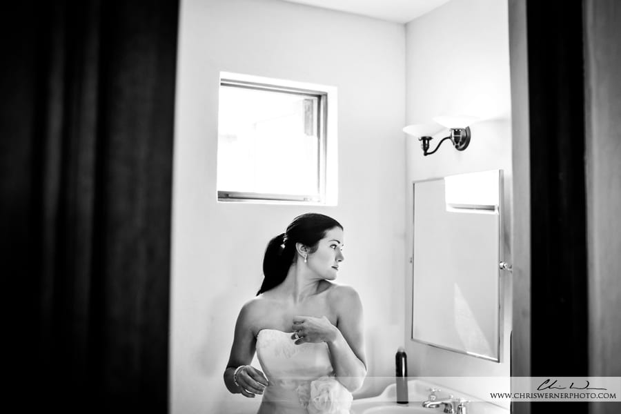 Napa bride looking in the mirror before her Napa Valley Estate Wedding.