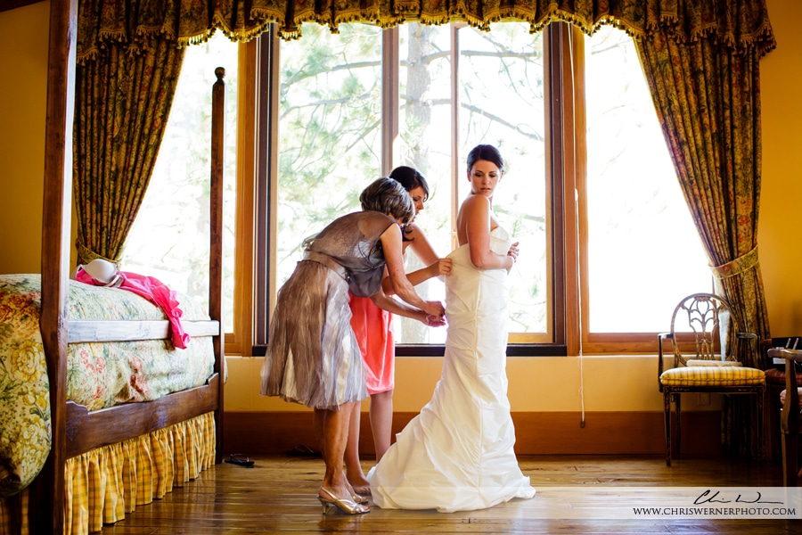 Photo of the mother of the bride and the maid of honor helping the bride, by wedding Photographers Lake Tahoe.