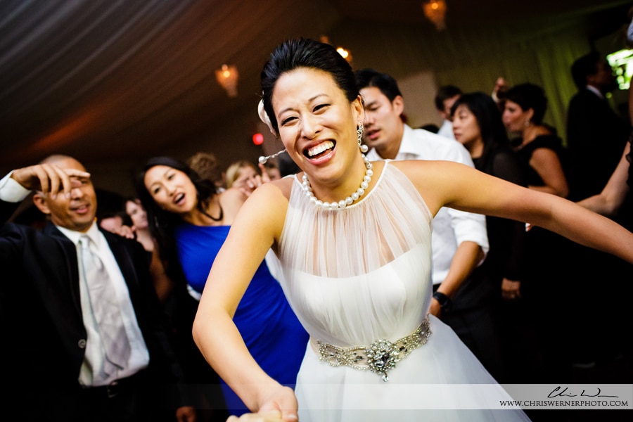 Bride dancing with her bridesmaids, by Wedding Photographers Napa Valley.