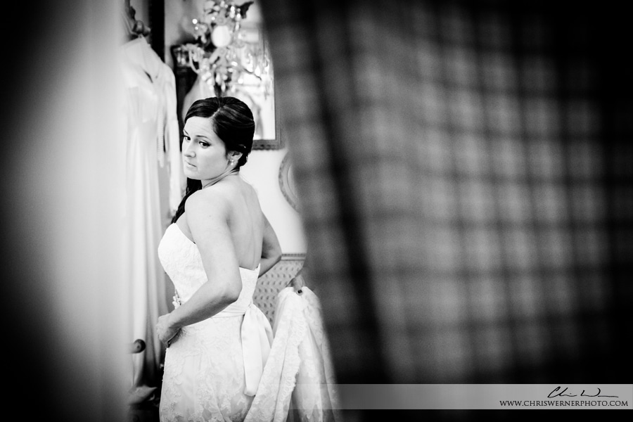 Black and white Raleigh wedding photo of the bride getting ready.