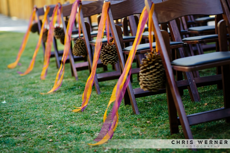 Fall wedding decorations with pine cones.