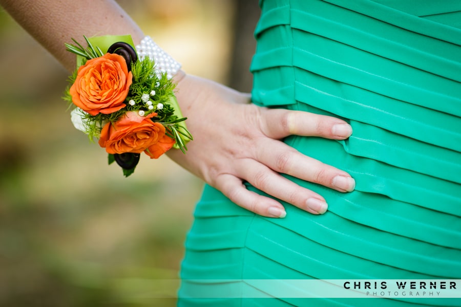 Orange wedding wrist corsage.