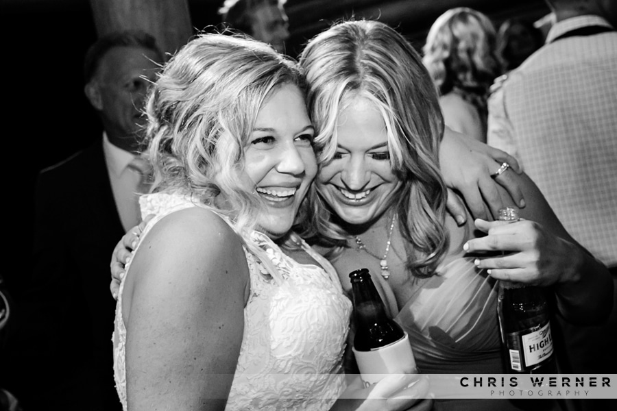 Candid wedding photo the bride and her sister, Lake Tahoe Tree Company wedding.