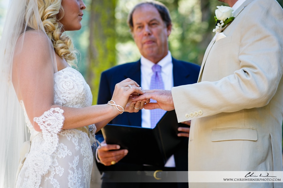 Lake Tahoe backyard wedding photo of the ring exchange.