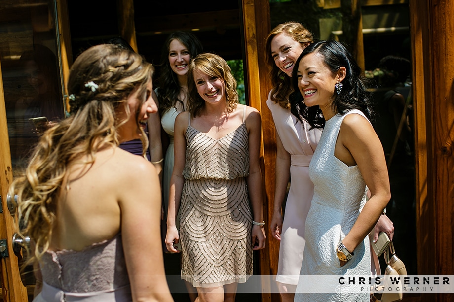 Bridesmaids looking at bride, Tahoe City Outdoor Wedding. 