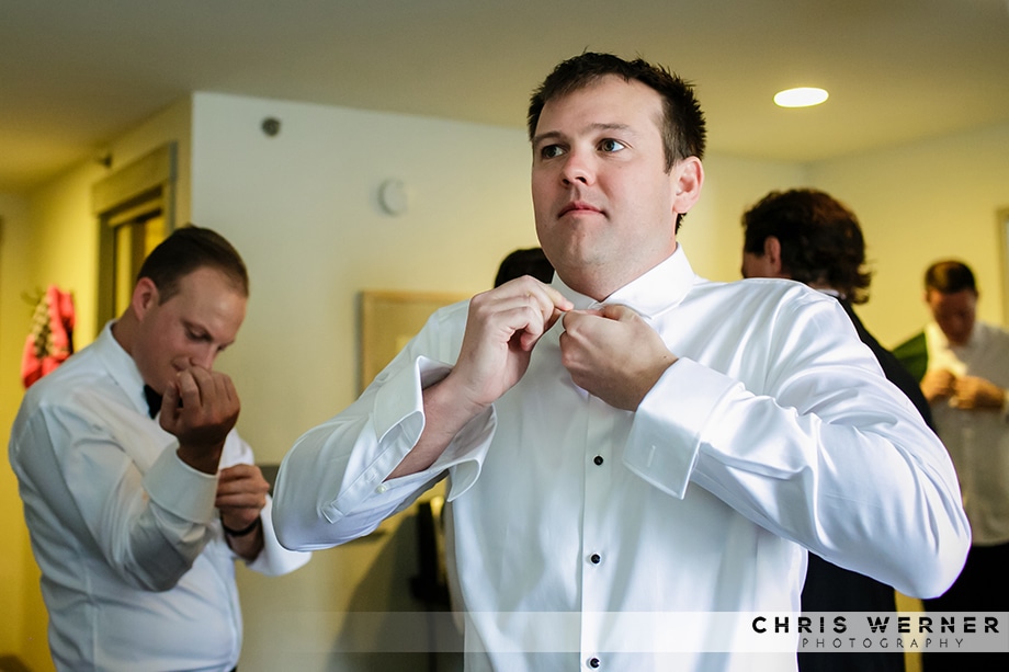 Groom getting dressed for a Squaw Valley winter wedding