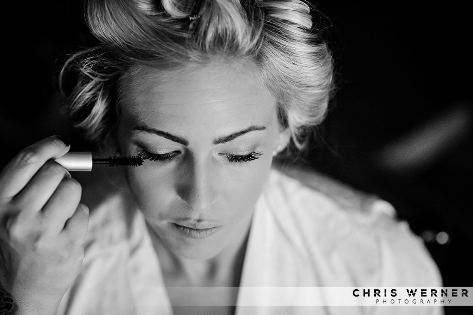 Black and white photo of a bride getting ready by a Reno wedding photographer