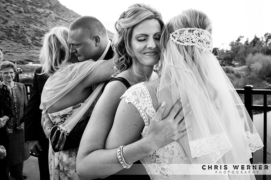 Maid of honor hugging the bride, photography by one of the best Reno wedding photographer