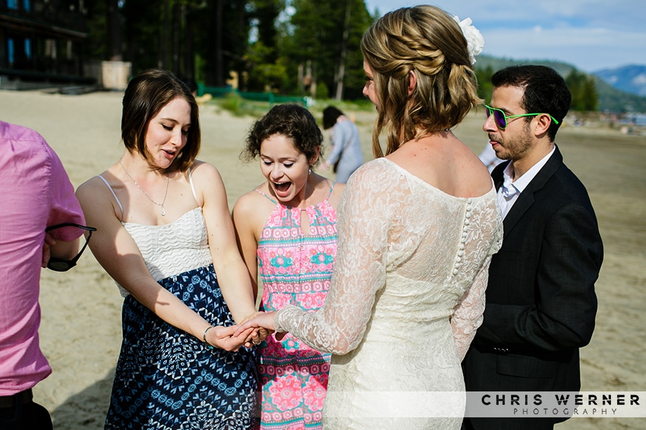 Brides friends admiring her new ring at a Lake Tahoe beach wedding