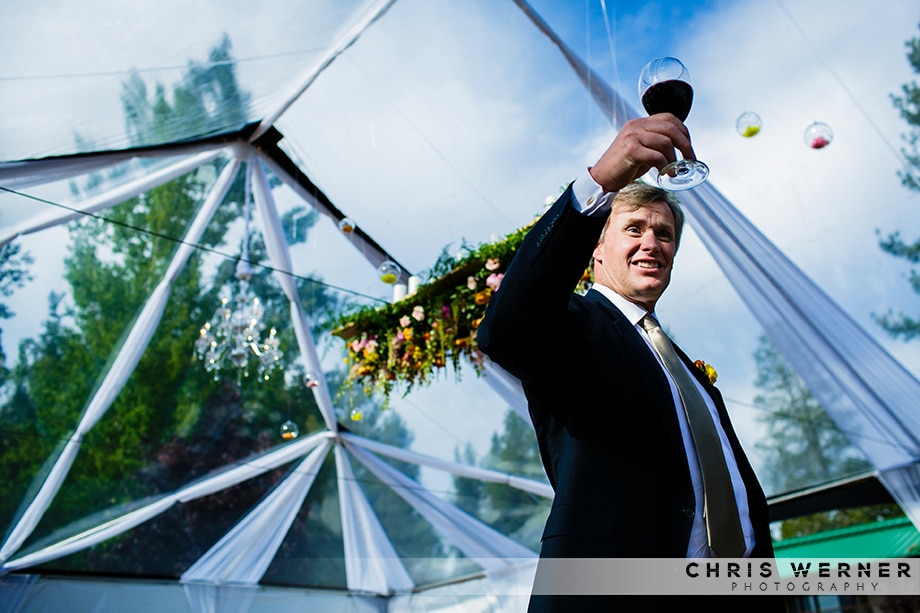 Father of the bride making a toast at a Lake Tahoe beach wedding reception.