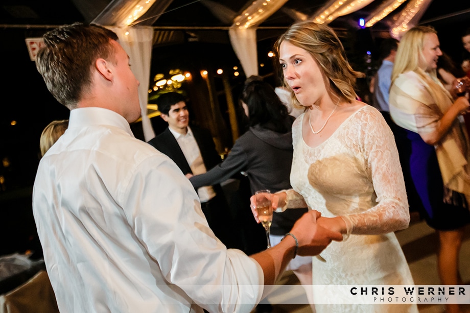 Bride dancing with her brother at a Lake Tahoe beach wedding reception.