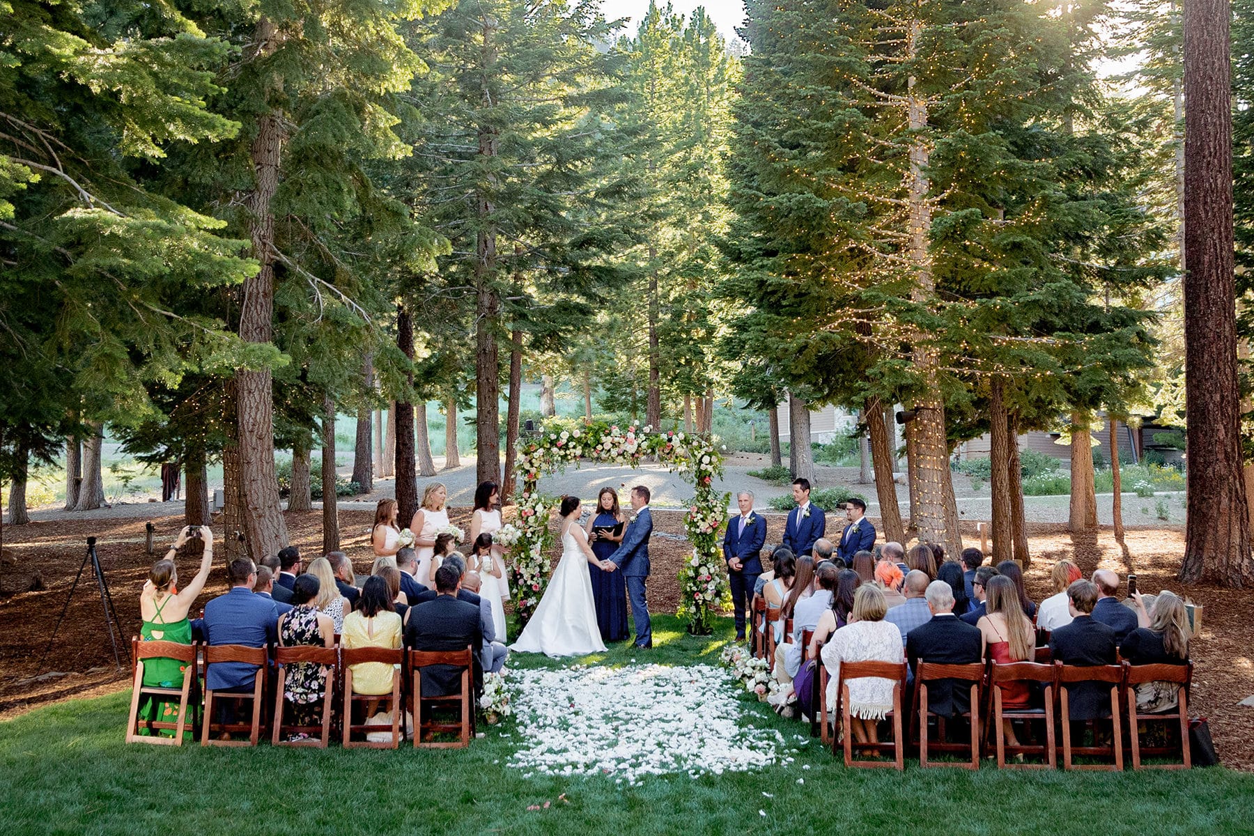 Wedding at the Ritz-Carlton Highlands in Truckee, CA. The bride and groom are standing at the altar during their ceremony at the Woods site.