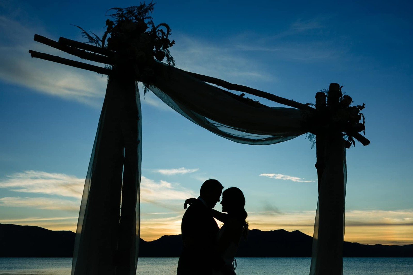 The sunset at a Lake Tahoe Edgewood wedding can be beautiful colors because the venue has views looking both east and west.