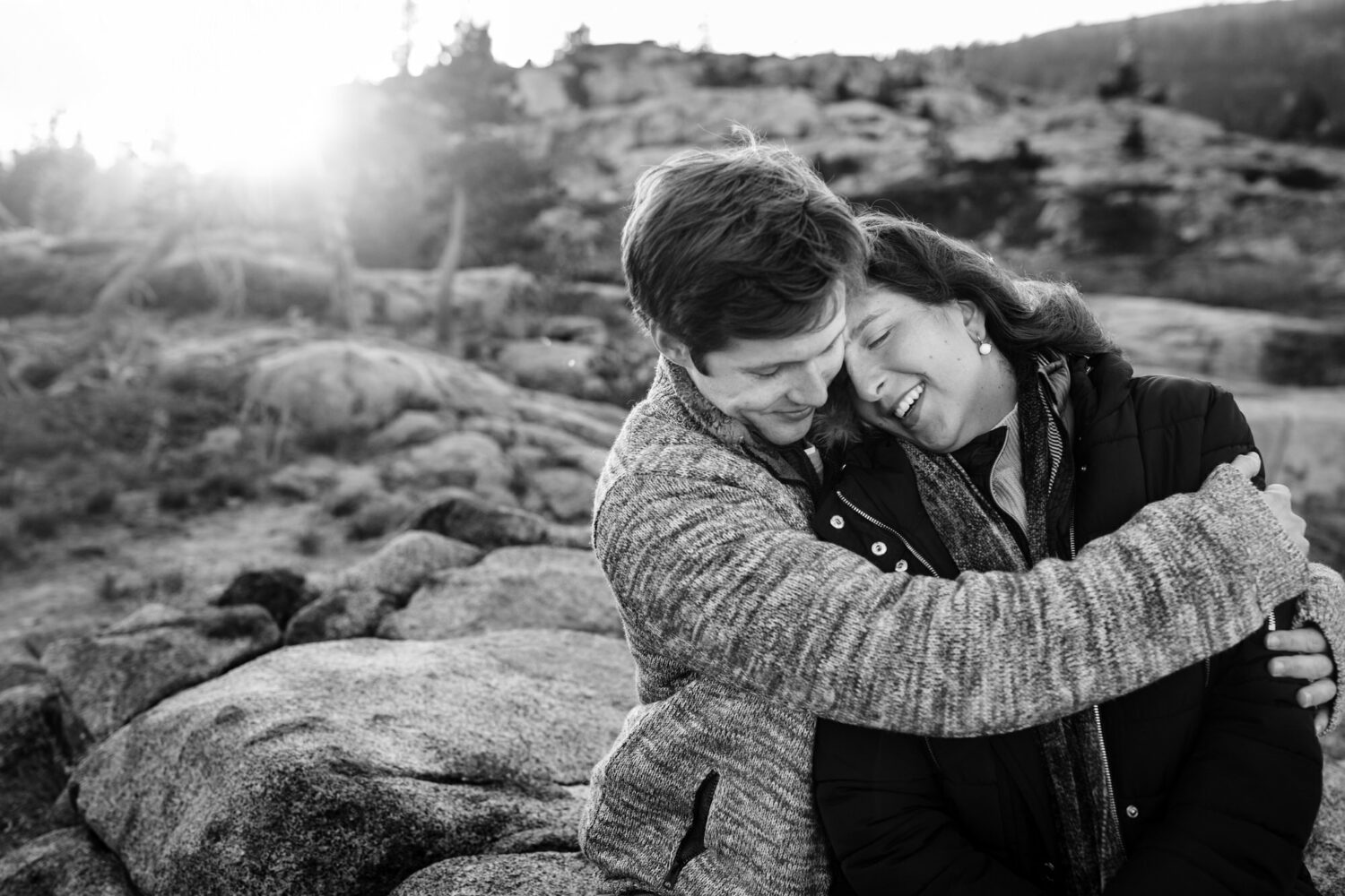 A warm embrace at sunset during a couple's engagement photos near Sugar Bowl Resort. 