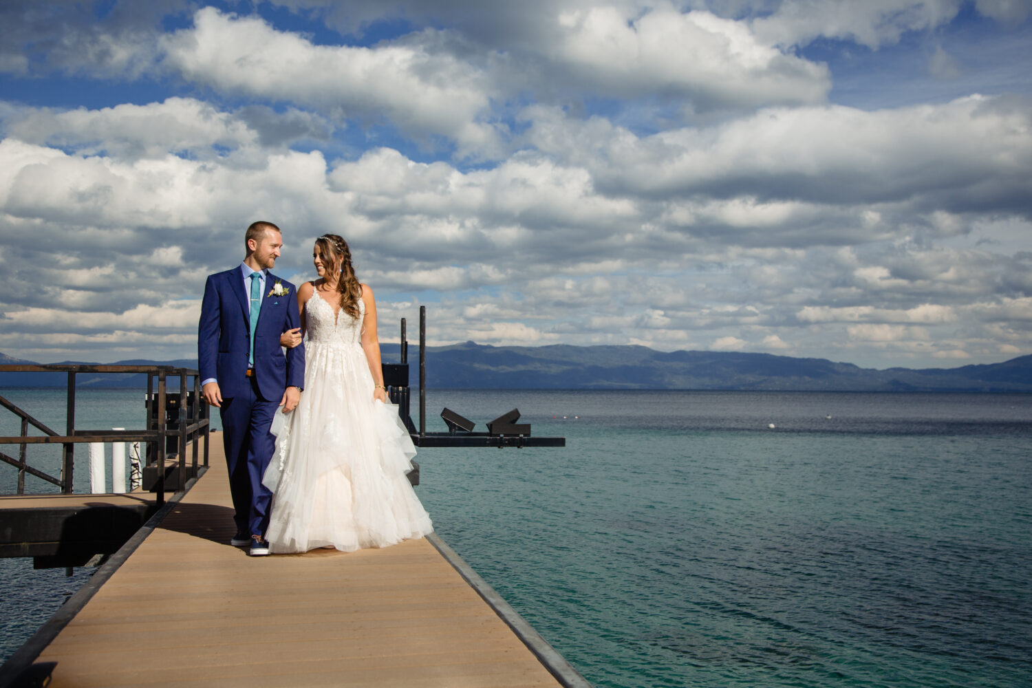 A romantic walk on the pier after getting married at a private home in Lake Tahoe.