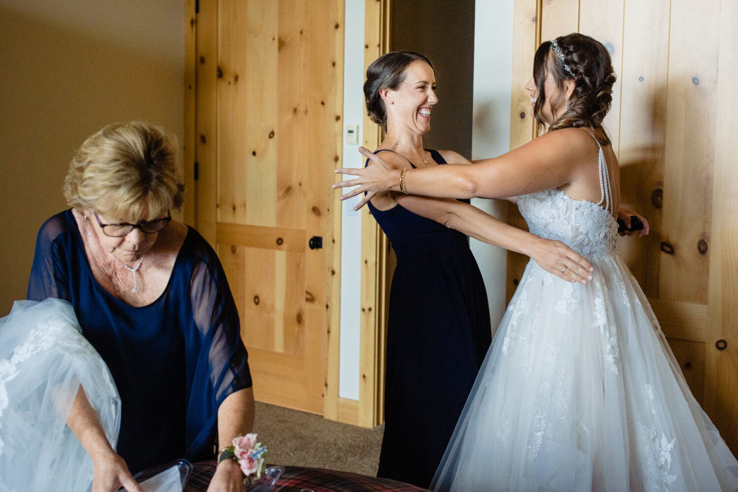 A joyful moment shared between the bride and her best friend, captured by Lake Tahoe wedding photographer Chris Werner.