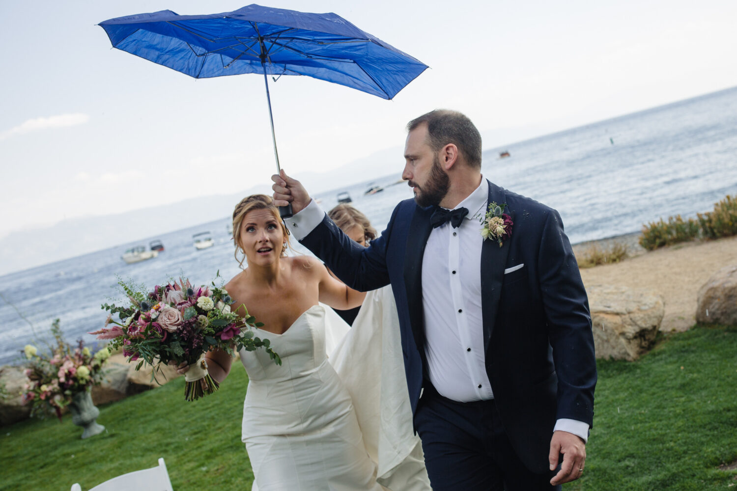 A rainy wedding day is good luck, even if your umbrella is broken.