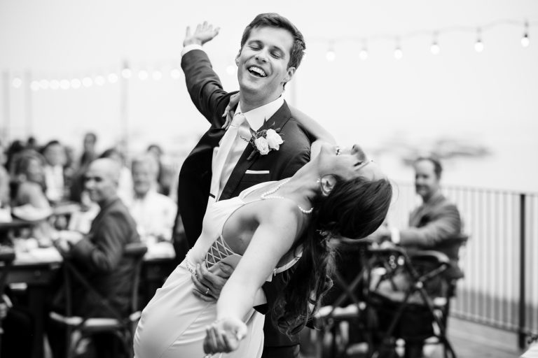 A choreographed first dance at a lakeside wedding.
