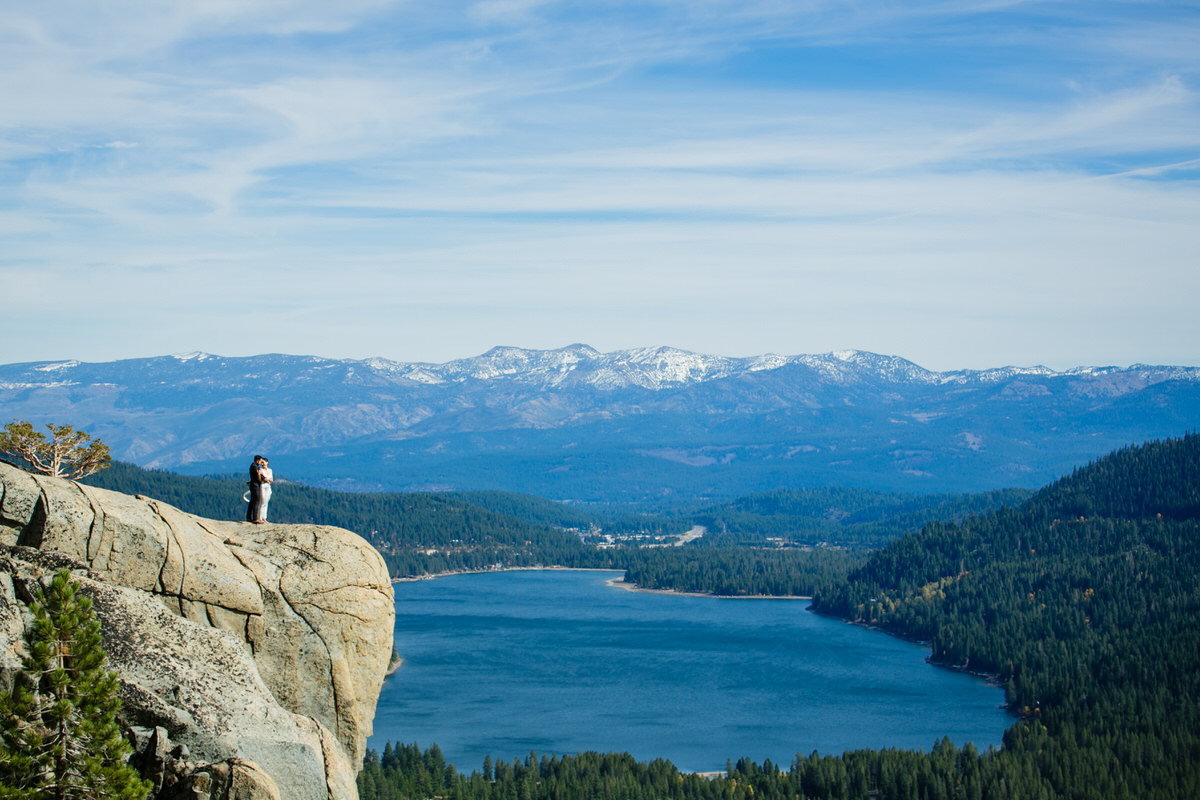 Eloping on a mountaintop above Donner Lake with the Carson Range mountains visible in the background.