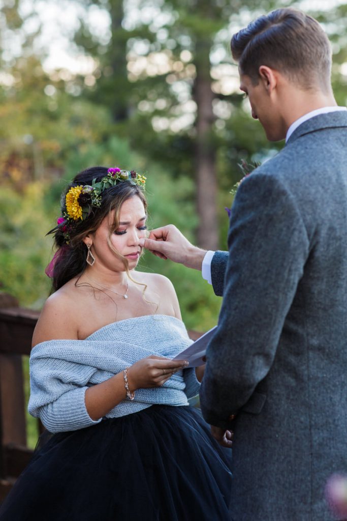 Lake Tahoe elopement with a black wedding dress and colorful bridal flower headband.