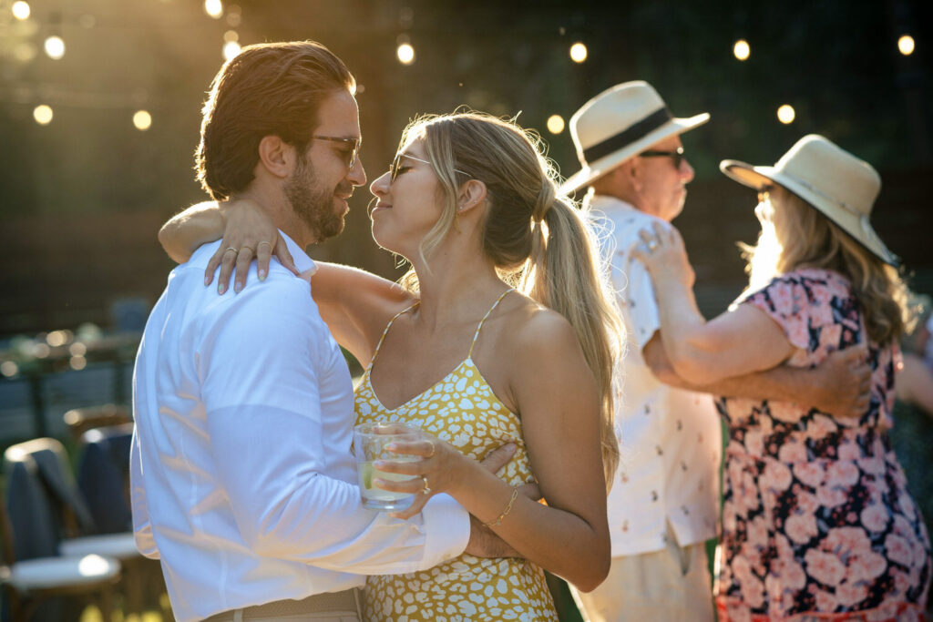 Wedding guests enjoy a warm summer evening on the dance floor at a Dancing Pines wedding reception.
