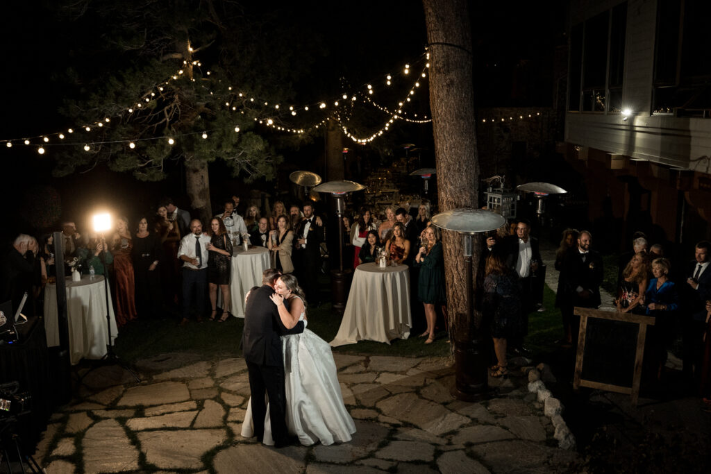 The father of the bride dances with his daughter on the outdoor patio at Thunderbird Lodge in Lake Tahoe.