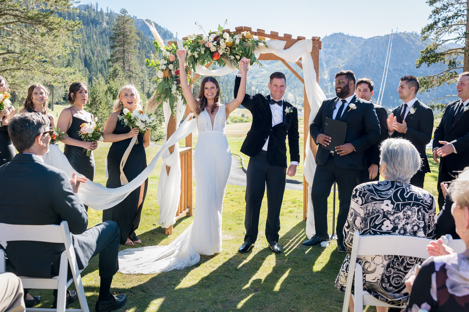 A celebratory moment for the bride and groom as they are pronounced married at Everline Resort & Spa in Olympic Valley.