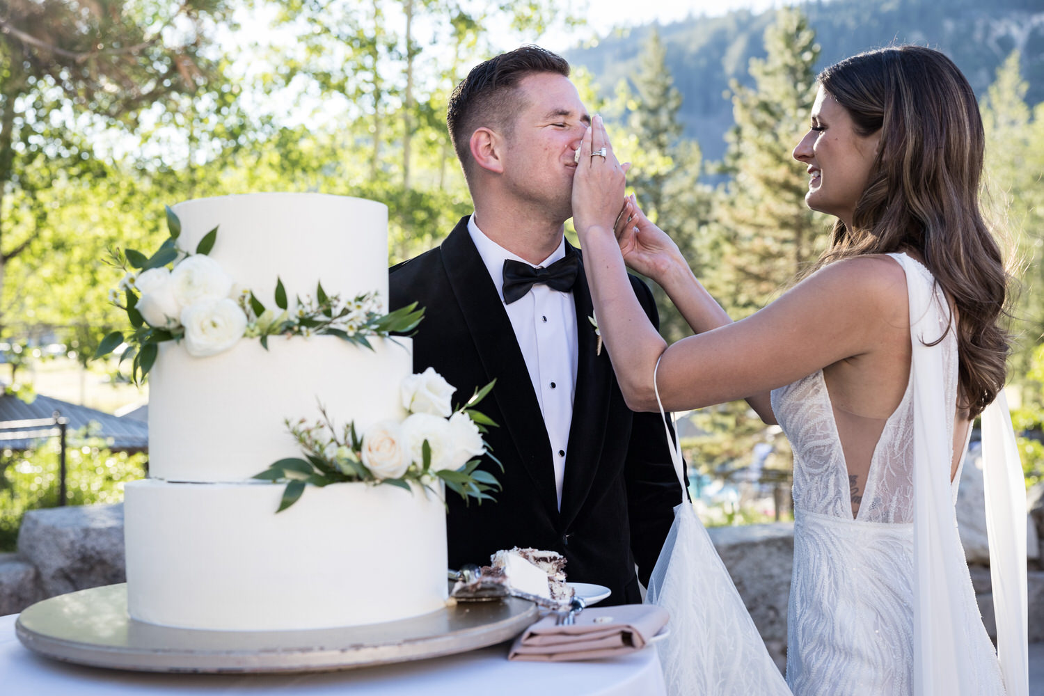 Smashing the wedding cake on the groom's face.