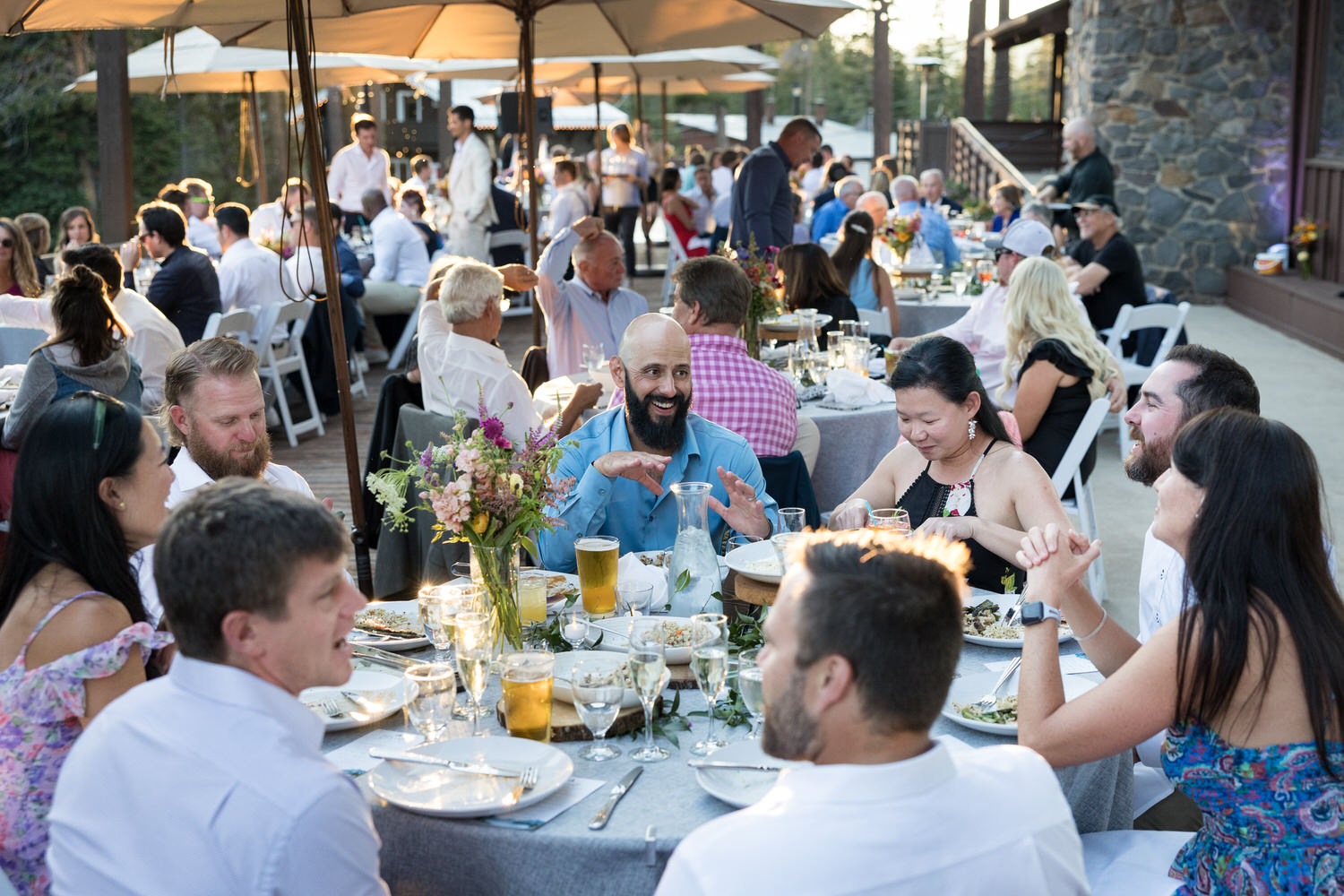 Guests enjoy outdoor dining at the Sugar Bowl Lodge during a warm summer evening.