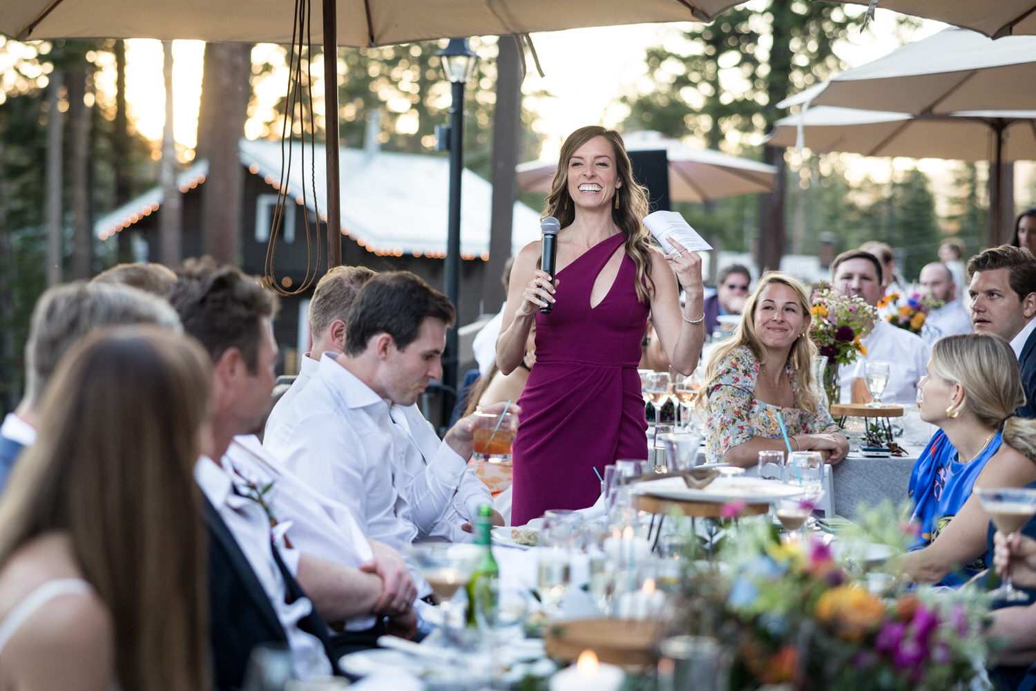 Champagne toast by the maid of honor at an outdoor reception on the Sugar Bowl Lodge deck.