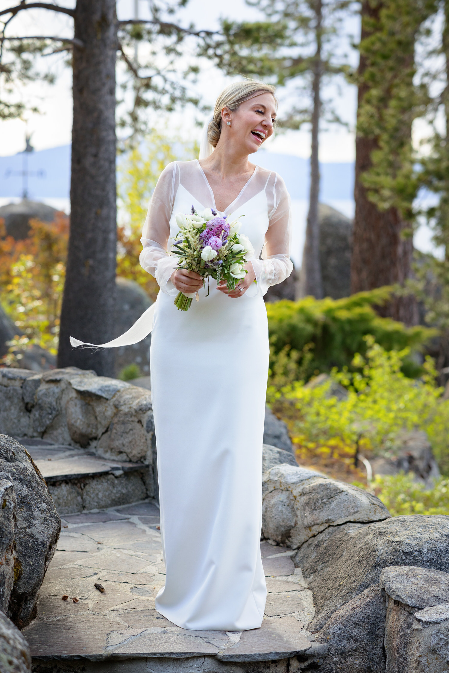 A joyful, candid portrait of the bride at a Thunderbird Lodge wedding.