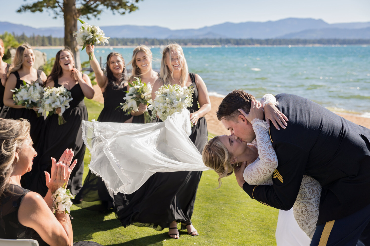 A romantic kiss on the North Lawn at an Edgewood Tahoe wedding ceremony.