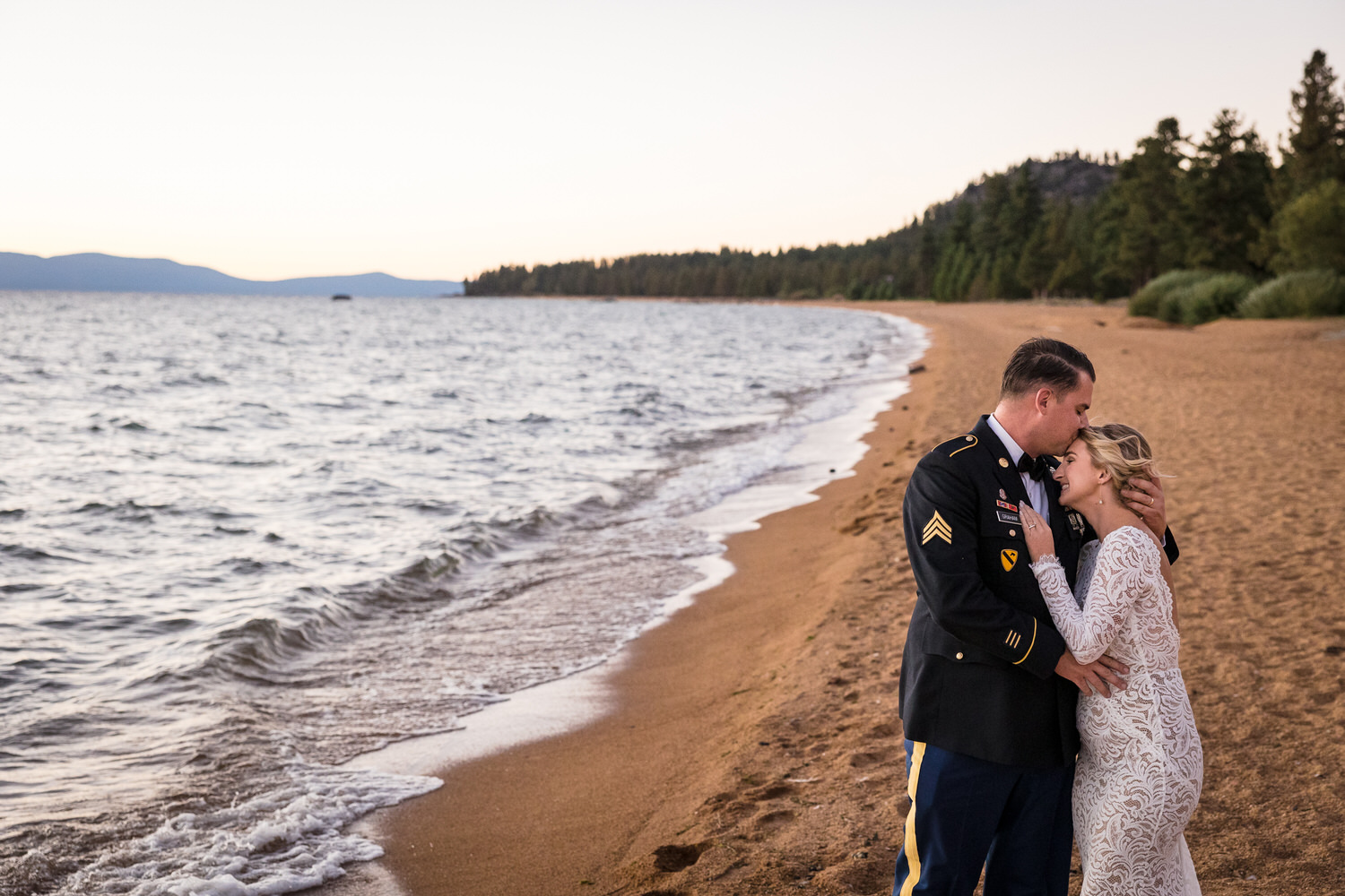 A romantic beach sunset portrait the of a United States Air Force groom and his bride.