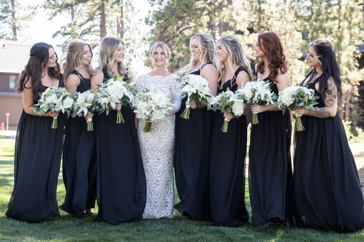 Black bridesmaid dresses are a good choice for a modern, outdoor wedding.