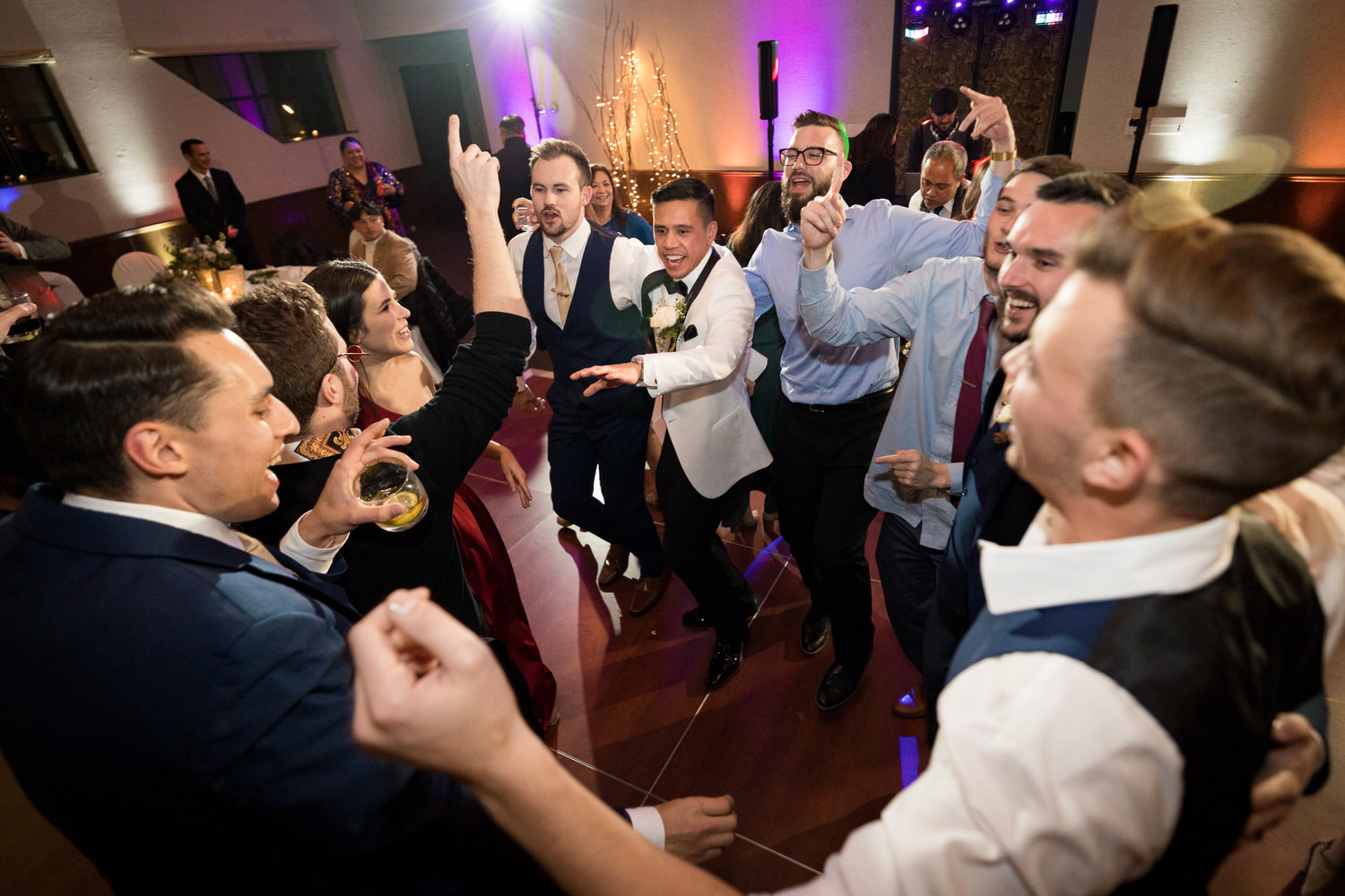Dancing with friends at a Mountain Room wedding reception.