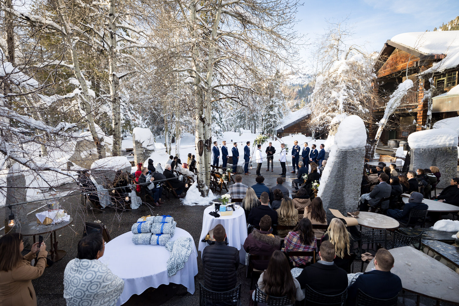 Wide angle view of a winter ceremony on the Upper Pool Patio.