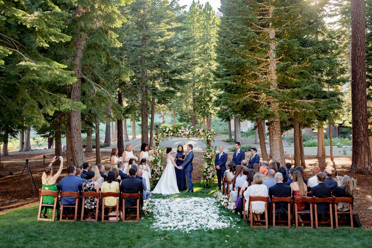 A wide angle view of a wedding ceremony at The Woods venue.