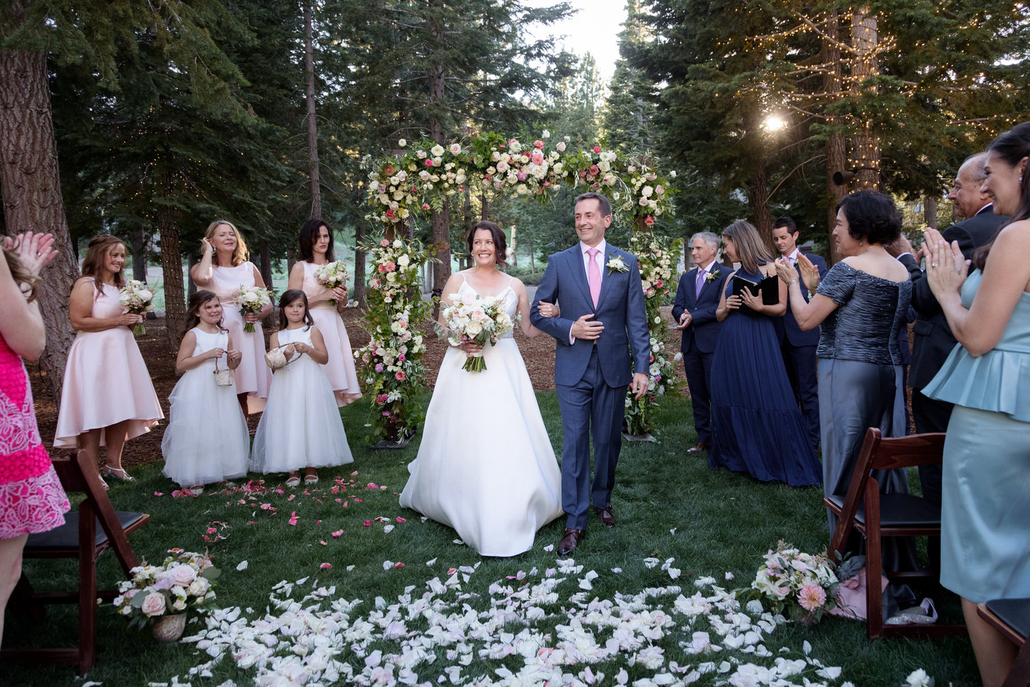An small outdoor wedding ceremony at The Woods, a forest-like venue at the Ritz Carlton Tahoe.
