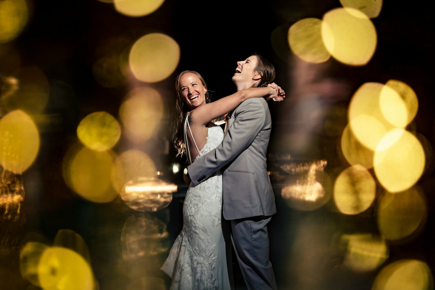 Beautiful lighting at a first dance for two brides.