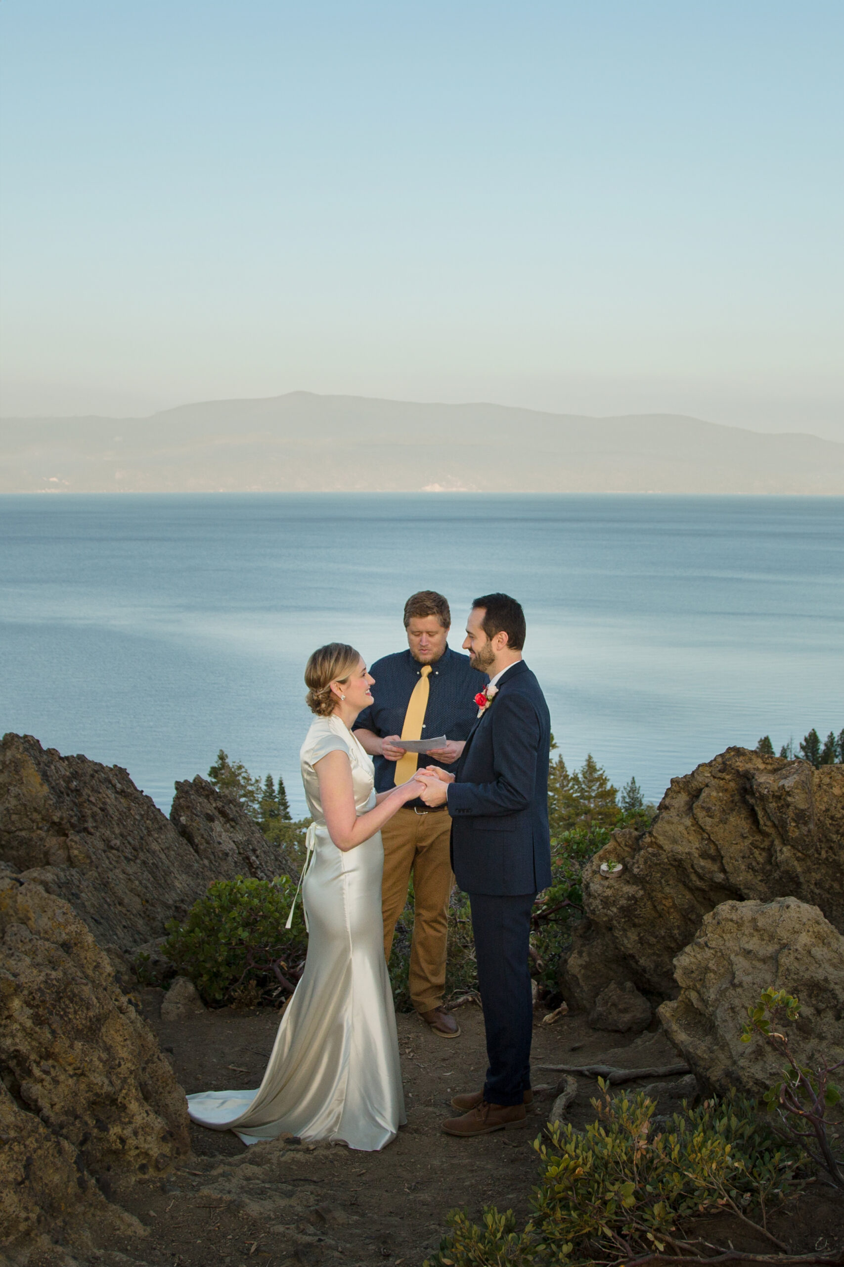 A bride, groom, and officiant at their Eagle Rock elopement wedding.