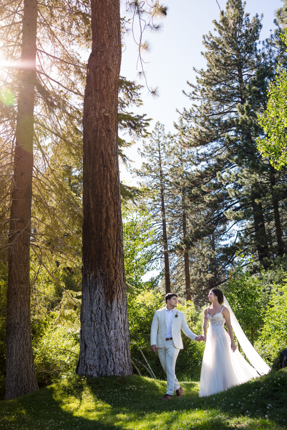 The bride and groom take a walk for their sunset photos at Aspen Grove in Incline Village.