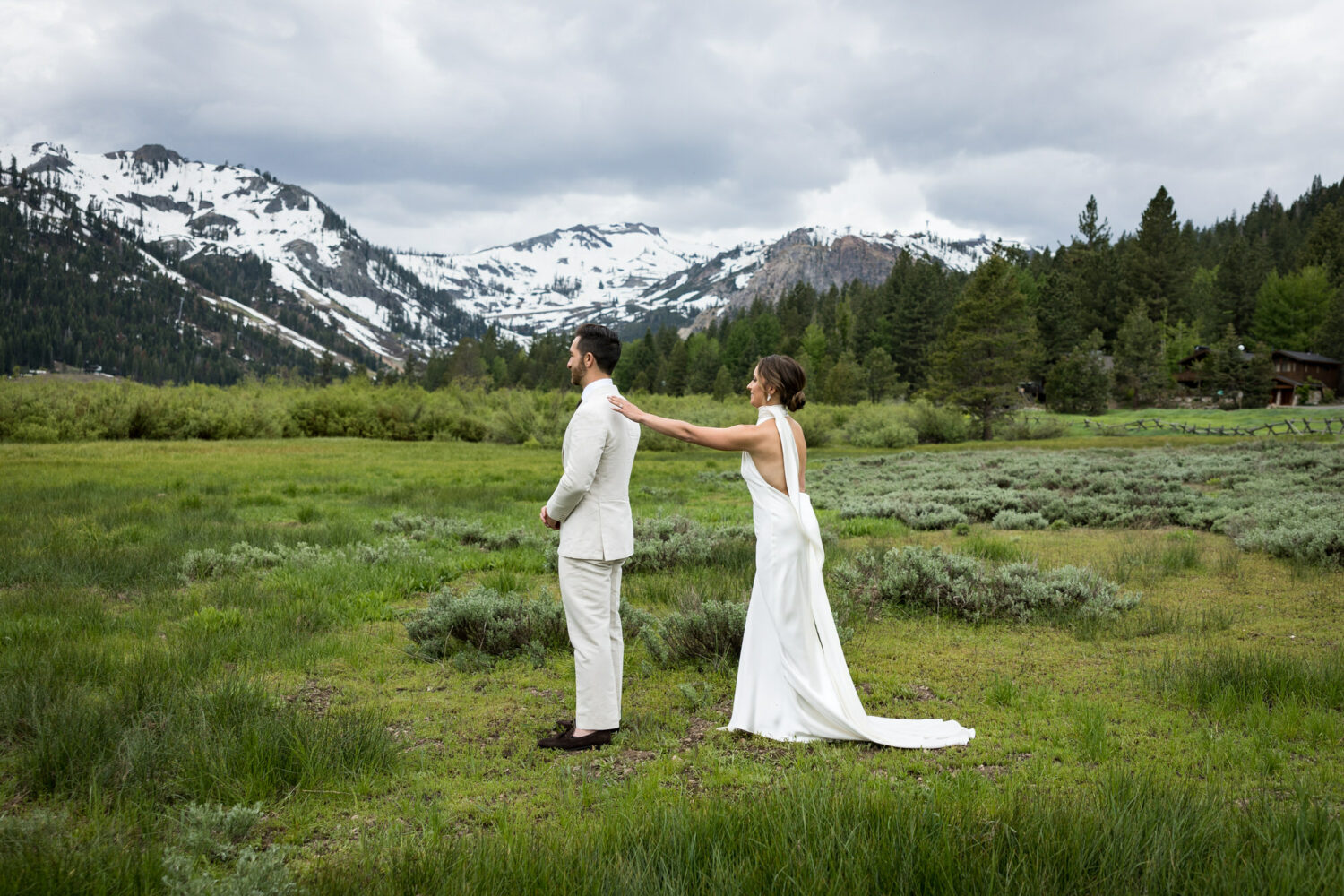 A bride and groom's first look in Olympic Valley.