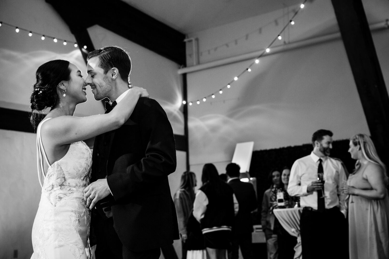 The bride and groom enjoy a romantic moment on the dance floor.