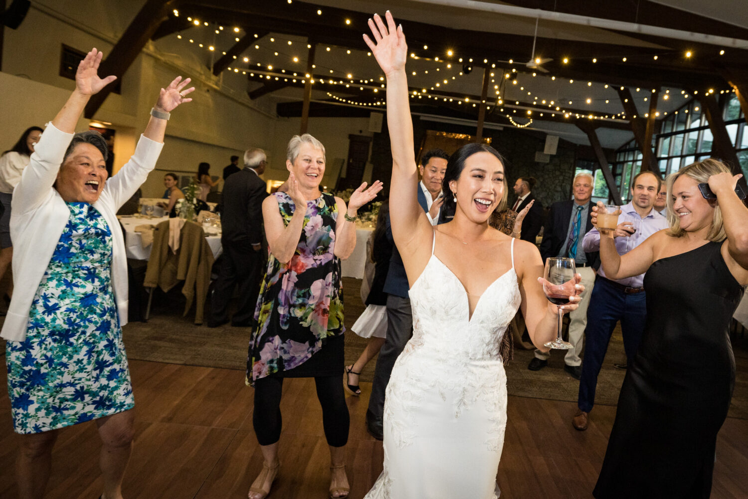 The bride and her wedding guests celebrate on the dance floor in the Palisades Events Center.