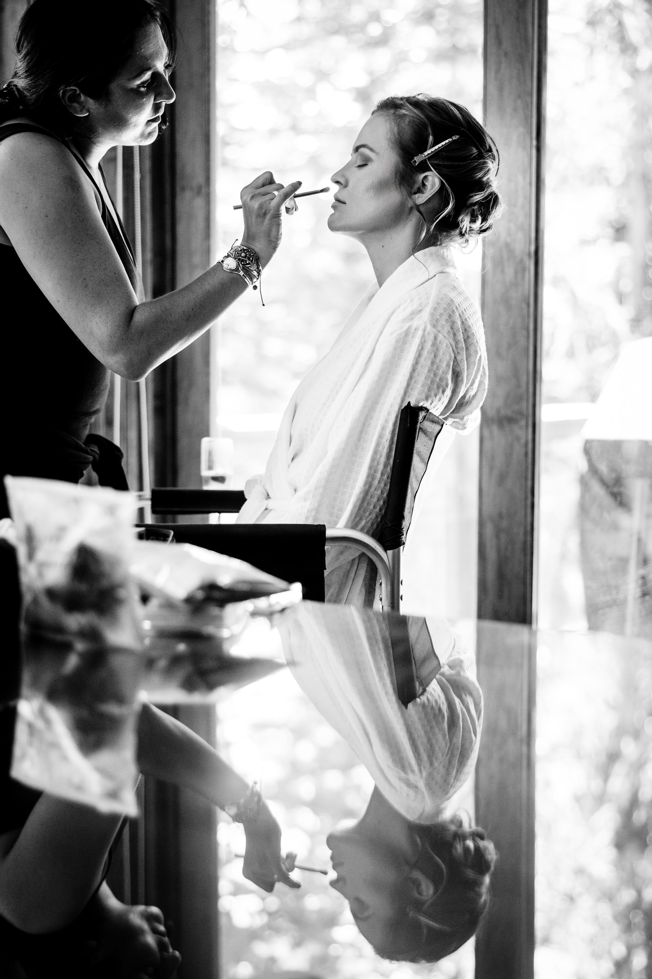 An artist applies makeup for a bride getting married in Incline Village.
