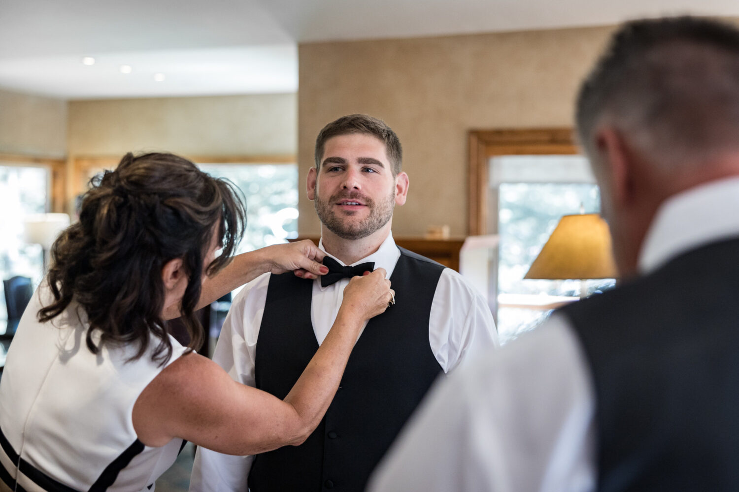 Family members help a groom get ready for a wedding in Incline Village.